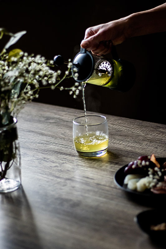 pouring green tea